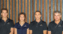 Design Direct leadership team standing against timber backdrop
